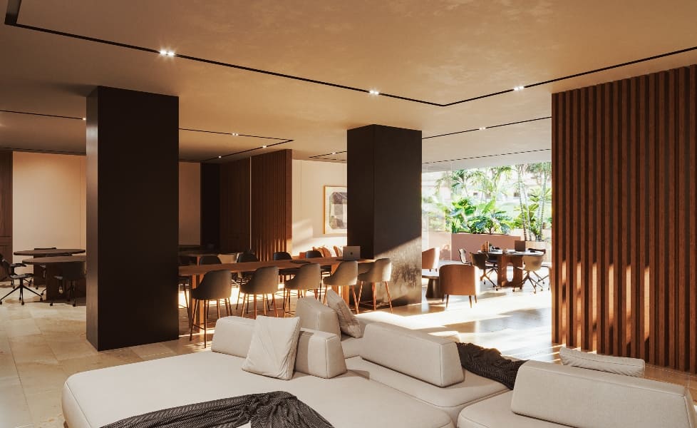 a room with a large couch and a dining table