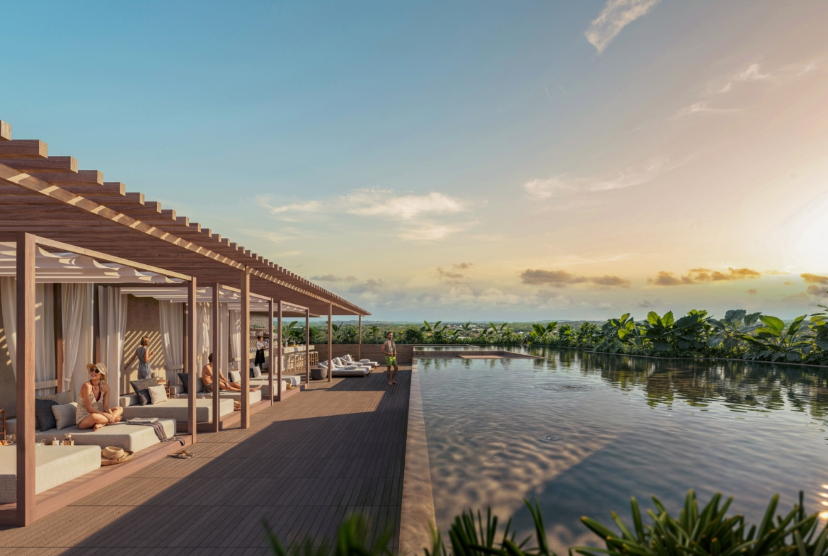 a group of people sitting on a deck next to a pool
