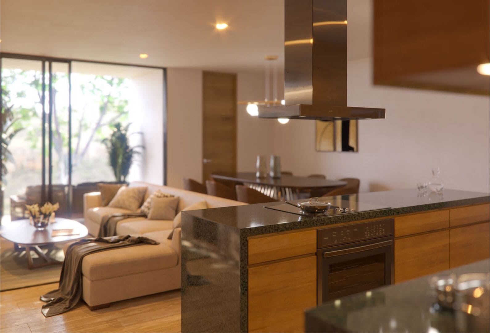 a living room with a couch and a kitchen