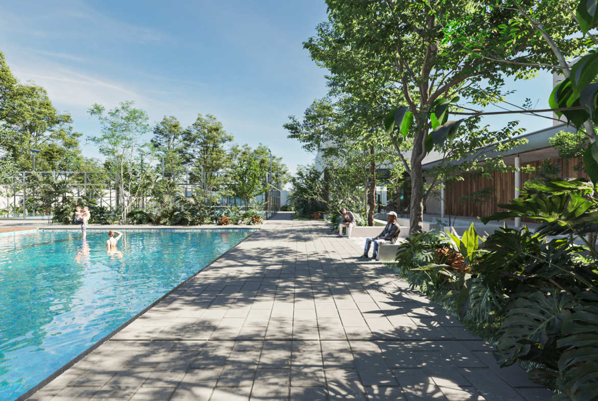 people sitting on benches near a pool