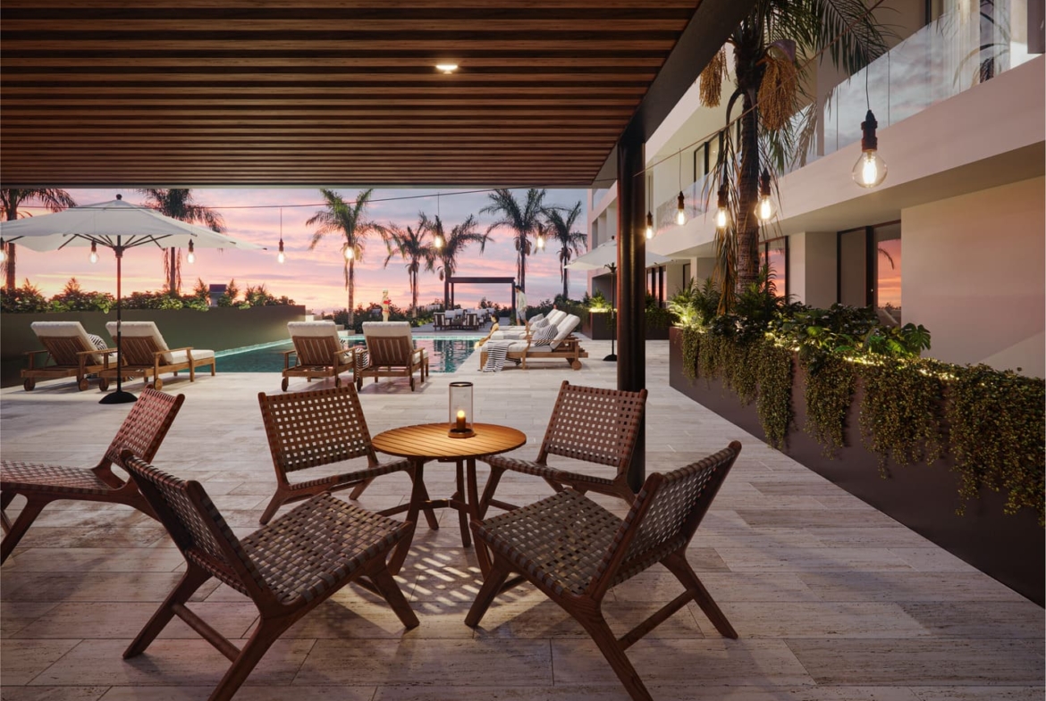 a patio with chairs and a table